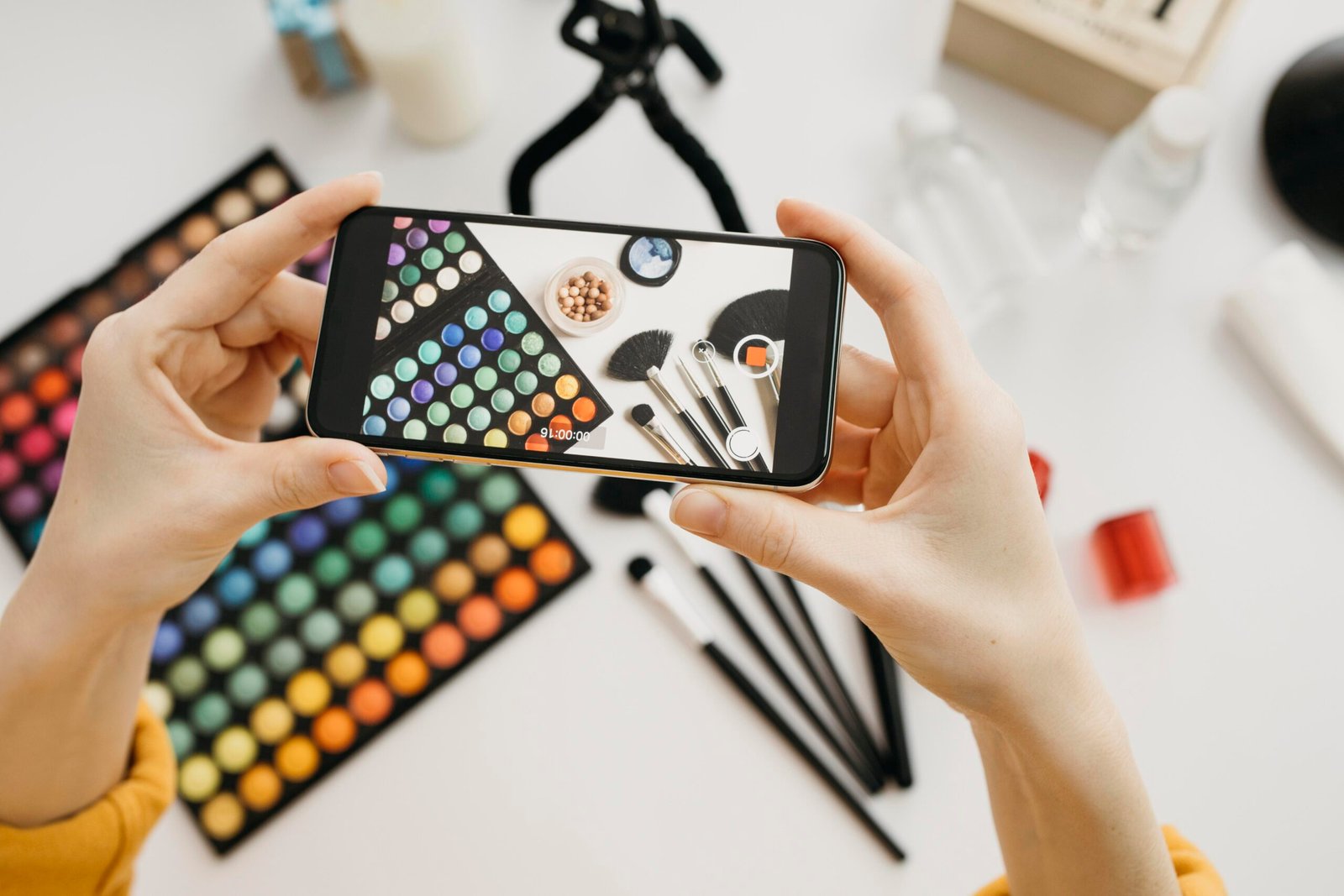 flat-lay-female-blogger-streaming-online-with-smartphone